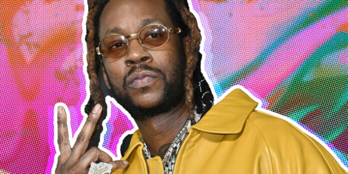 2 Chainz in front of abstract background