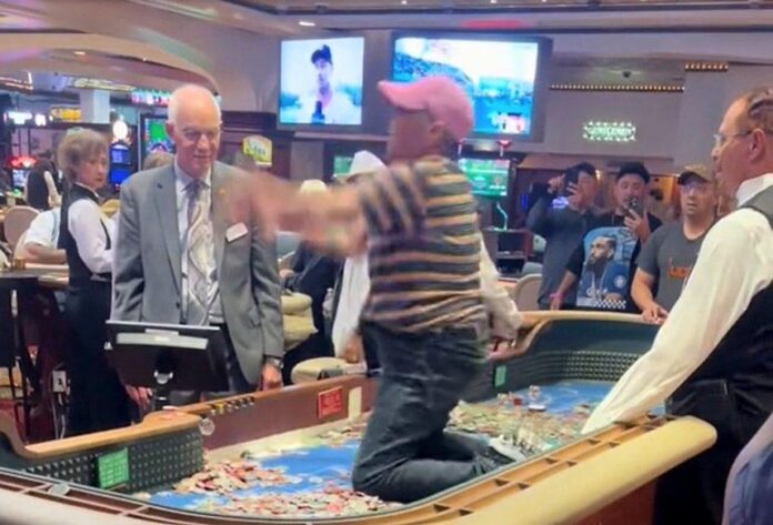 HOLY CRAPS Woman Climbs Atop Reno Casino Table to Chuck