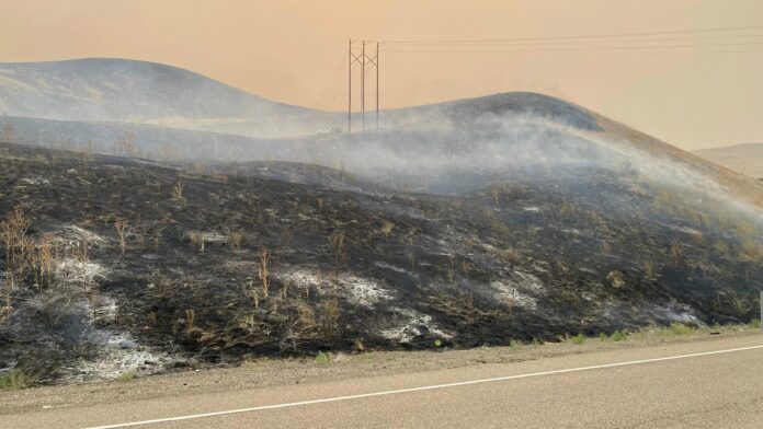 Oregon fire is the largest burning in the US. Officials warn an impending storm could exacerbate it