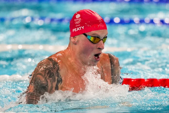 Adam Peaty, of Britain, competes in the men's 100-meter breaststroke final at the 2024 Summer Olympics, Sunday, July 28, 2024, in Nanterre, France.