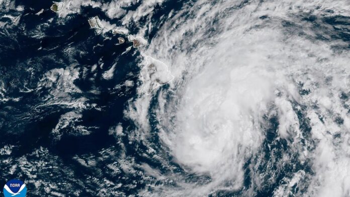 Hurricane Hone sweeps past Hawaii, dumping enough rain to ease wildfire fears