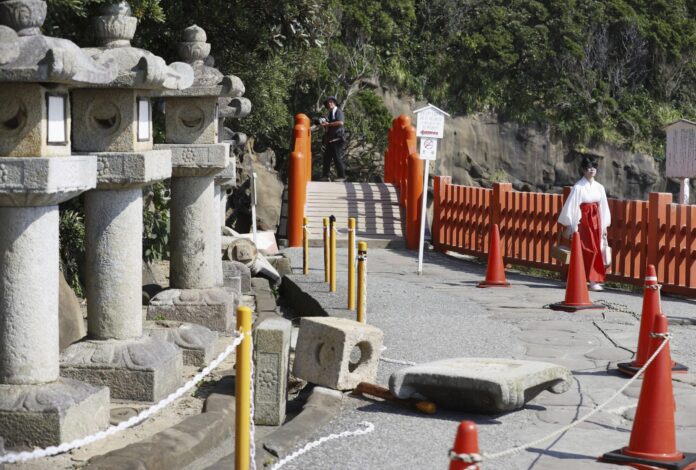 Stone lanterns fall at a shrine following a strong earthquake in Nichinan, Miyazaki prefecture, southern Japan, on Aug. 9, 2024. (Kyodo News via AP).