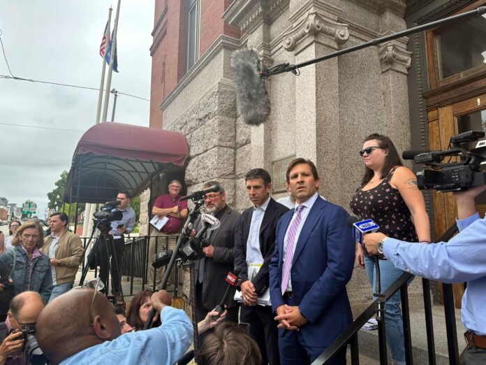 Attorney Ben Gideon attorney for victims of the Lewiston mass shooting and their families, talks to reporters outside Lewiston City Hall, on Tuesday, Aug. 20, 2024, in Lewiston, Maine. (AP Photo/Patrick Whittle).