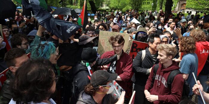 Pro-Palestinian protesters clash with counter-protesters during a rally on the campus of the University of Chicago in Illinois, on May 3, 2024. (Photo by Alex Wroblewski / AFP) (Photo by ALEX WROBLEWSKI/AFP via Getty Images)