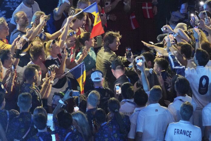 Tom Cruise abseils into Paris Olympic closing ceremony