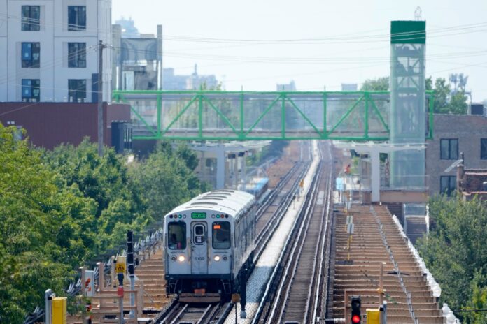 A Chicago Transit Authority Green Line train passes the new Damen Ave. station Sunday, Aug. 4, 2024, near the United Center where the Democratic National Convention will convene Monday, August 19, in Chicago. (AP Photo/Charles Rex Arbogast)