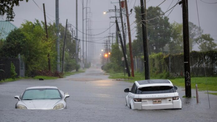 An ER nurse says it was ‘second nature’ to rescue a man trapped in hurricane floodwaters