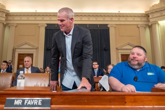 Former NFL quarterback Brett Favre arrives to appear before the House Committee on Ways and Means on Capitol Hill, Tuesday, Sept. 24, 2024, in Washington. (AP Photo/Mark Schiefelbein).