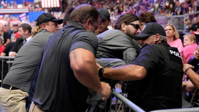 Man arrested at Trump rally in Pennsylvania wanted to hang a protest banner, police say