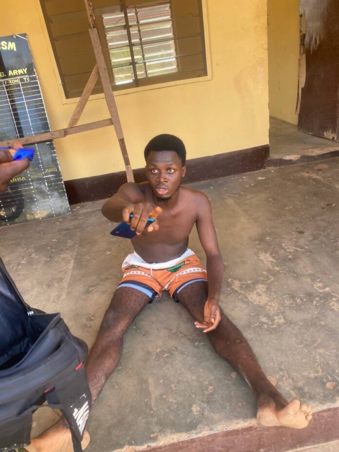 PHOTO: ADELEYE AYOMIDE, the serial killer, demanded N1.5M from Christianah Idowu parents using Betting account as he got arrested holding a blue ITEL A56 phone