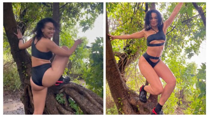 PHOTO: Pearl Thusi climbing trees half naked while wearing black pants during vacation in Zambia