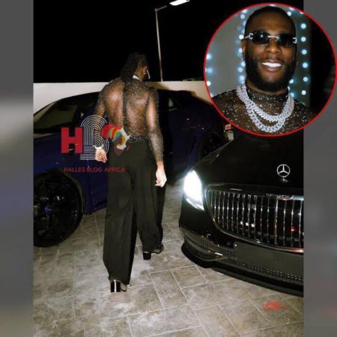 PHOTO: South Africans are saying P Diddy fucked Burna Boy in the ass as he wore prostitute outfit to his baby oil party