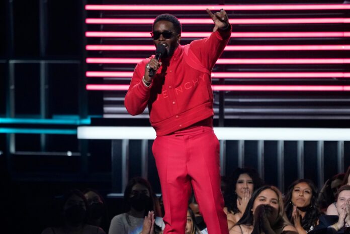 Host Sean "Diddy" Combs presents the revolt black excellence award at the Billboard Music Awards, May 15, 2022, at the MGM Grand Garden Arena in Las Vegas. (AP Photo/Chris Pizzello, File).