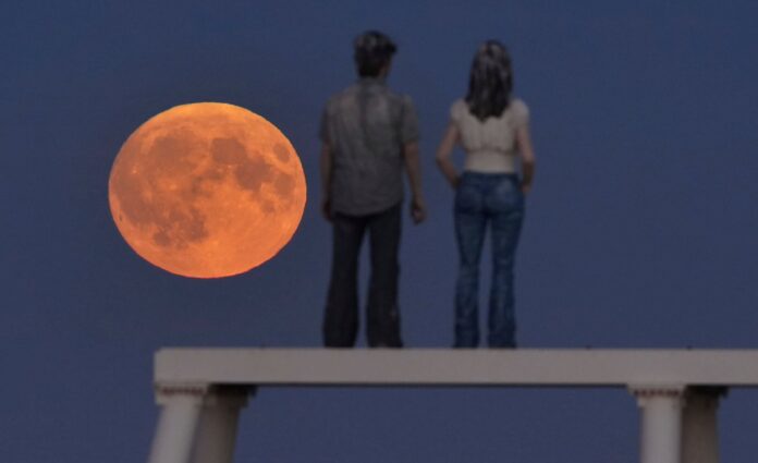 Rare harvest supermoon lunar eclipse dazzles UK stargazers