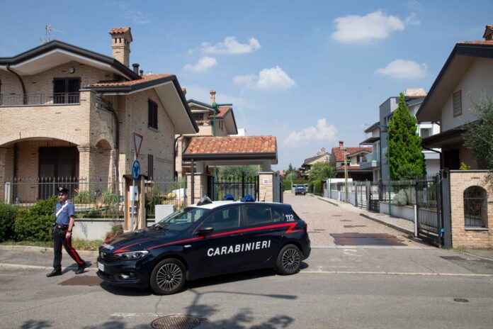 Italian Carabinieri patrol outside the house where a 17-year-old boy killed his brother and parents in Paderno Dugnano near Milan, northern Italy, Sunday, Sept. 1, 2024. Italian prosecutors on Monday said a 17-year-old high school student who confessed to stabbing to death his 12-year-old brother and parents had been suffering a general sense of “malaise,” but has been unable to provide a motive for a triple homicide that has shocked Italians. (Marco Ottico/Lapresse via AP).