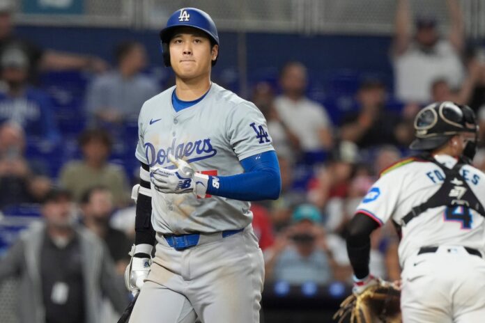 Los Angeles Dodgers' Shohei Ohtani (17) reacts after striking out during the eighth inning of a baseball game against the Miami Marlins, Wednesday, Sept. 18, 2024, in Miami. (AP Photo/Marta Lavandier).