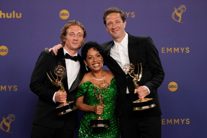 Jeremy Allen White, winner of the award for outstanding lead actor in a comedy series for "The Bear", from left, Liza Colon-Zayas, winner of the award for outstanding supporting actress in a drama series for "The Bear", and Ebon Moss-Bachrach, winner of the award for outstanding supporting actor in a comedy series for "The Bear" pose in the press room during the 76th Primetime Emmy Awards on Sunday, Sept. 15, 2024, at the Peacock Theater in Los Angeles. (AP Photo/Jae C. Hong).