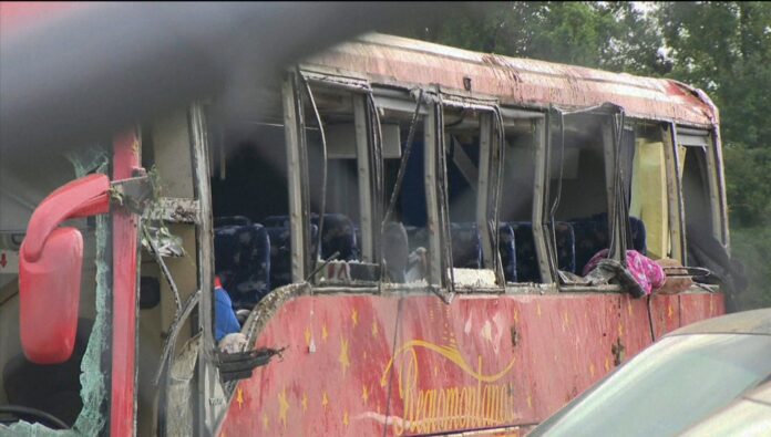 A damaged bus is shown after several people were killed and dozens injured after the commercial bus overturned on Interstate 20 early Saturday, Aug. 31 2024 in Warren County, Miss., according to the Mississippi Highway Patrol. (WAPT via AP).