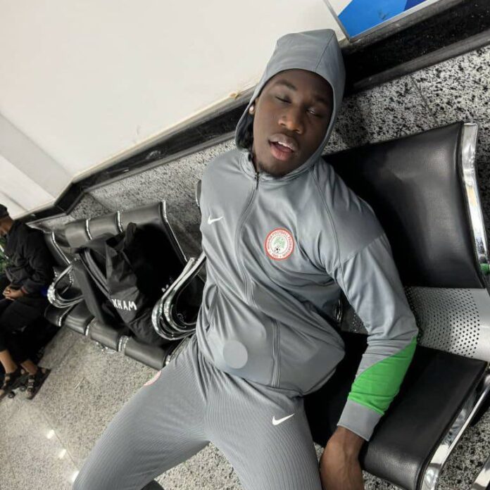 PHOTO: Calvin Bassey becomes a meme while sleeping with his mouth wide open after being stranded in Al Abraq Airport, Libya  