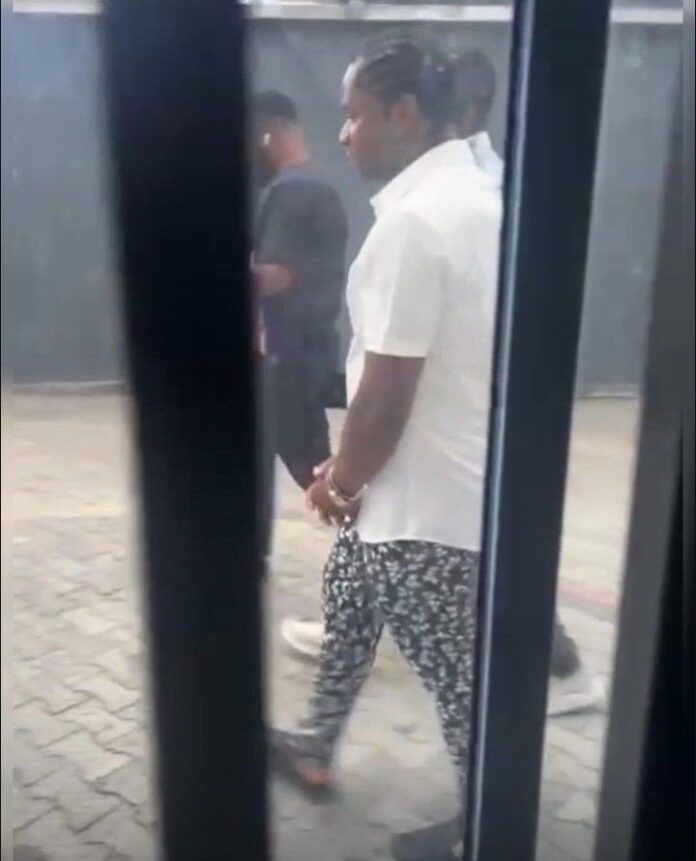 VIDEO: Akpi Speed Darlington gets arrested by police as clip of him in handcuffs goes viral after claiming Diddy banged Burna Boy